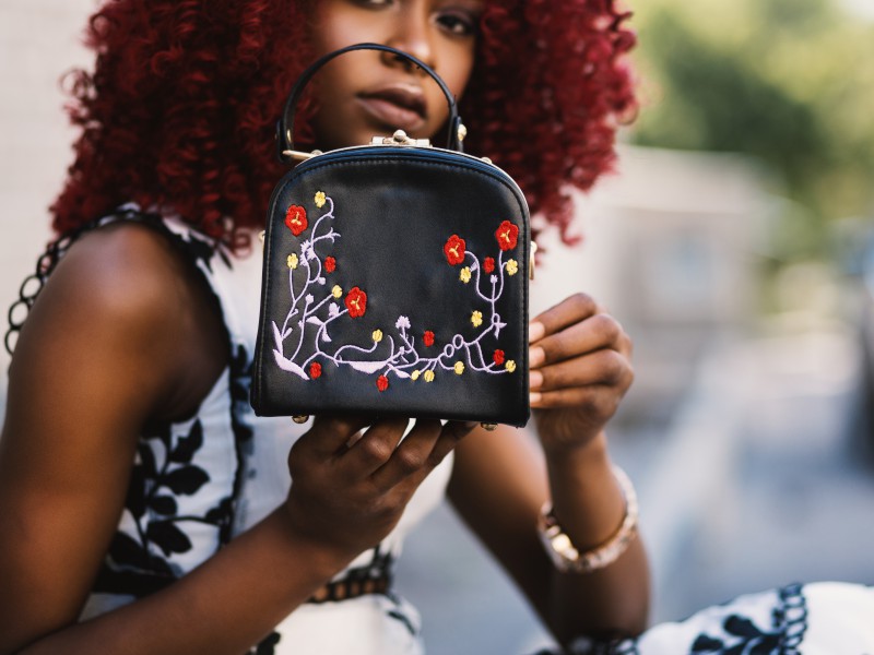 Lady with embroided bag